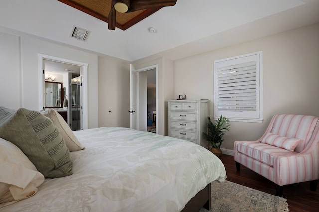 bedroom with baseboards, visible vents, and dark wood finished floors