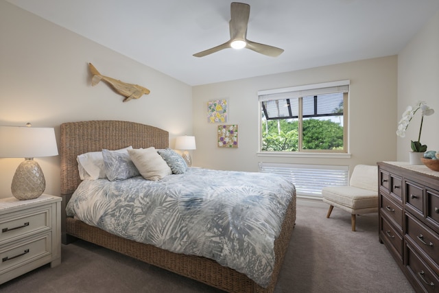 bedroom with ceiling fan and dark colored carpet