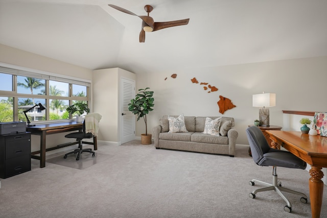 home office with lofted ceiling, ceiling fan, carpet flooring, and baseboards