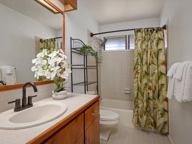 bathroom with vanity, shower / bath combination with curtain, toilet, and backsplash