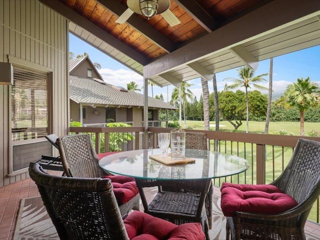 exterior space with outdoor dining area and ceiling fan