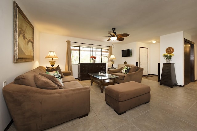 living room featuring ceiling fan and light tile patterned floors