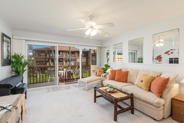 living room with carpet, a sunroom, and ceiling fan