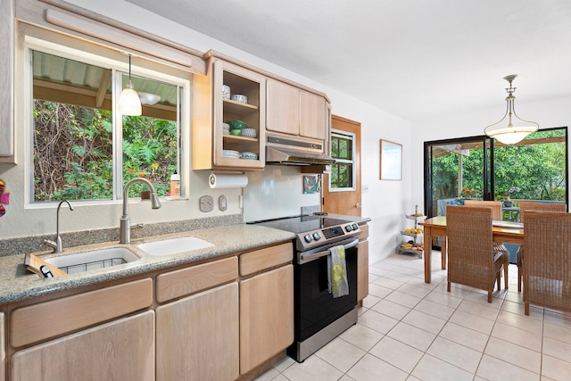 kitchen featuring under cabinet range hood, a sink, stainless steel range with electric cooktop, light brown cabinetry, and glass insert cabinets