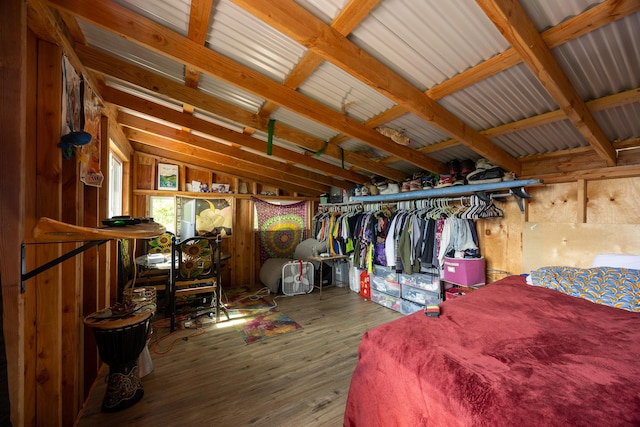 interior space with vaulted ceiling and wood finished floors