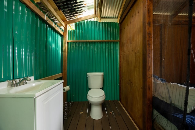 half bath with vanity and toilet