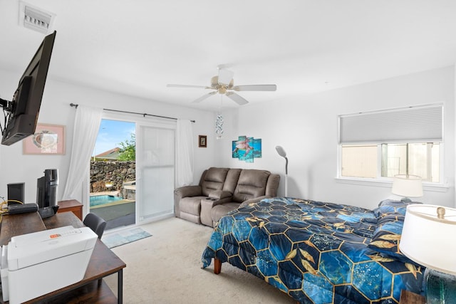 bedroom featuring access to exterior, visible vents, carpet flooring, and a ceiling fan