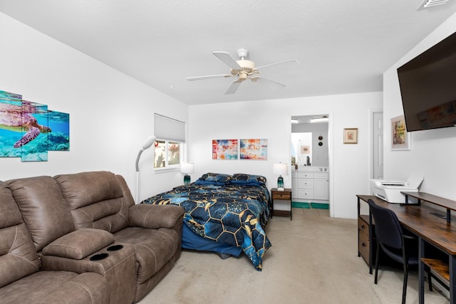 bedroom featuring connected bathroom, a ceiling fan, and light colored carpet