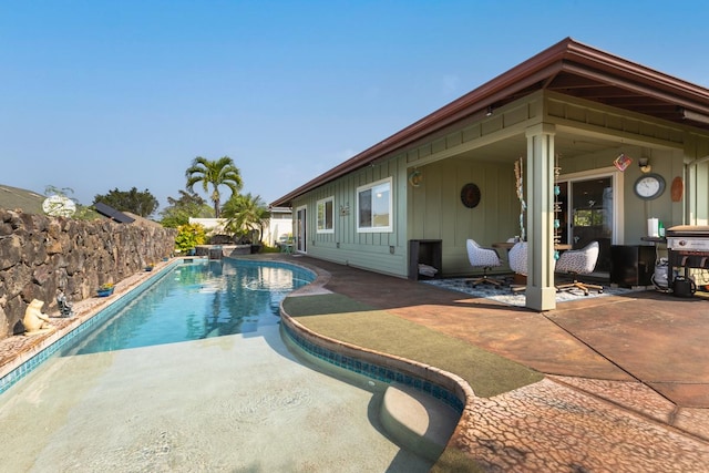 view of swimming pool with a fenced in pool, a patio area, and area for grilling