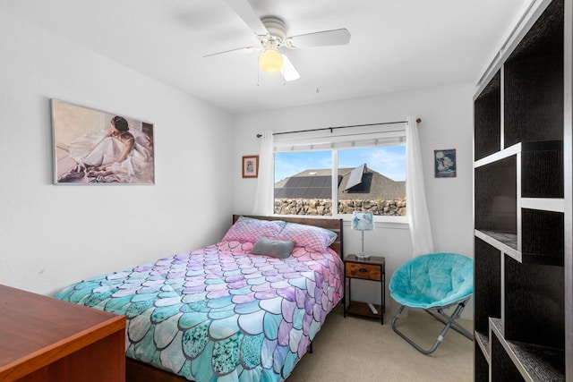 carpeted bedroom featuring ceiling fan