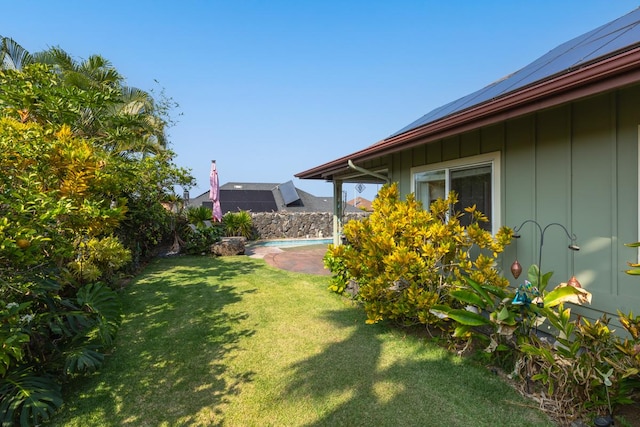 view of yard featuring an outdoor pool