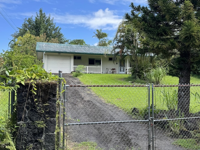 view of front of home with a garage, a gate, fence, a porch, and a front yard