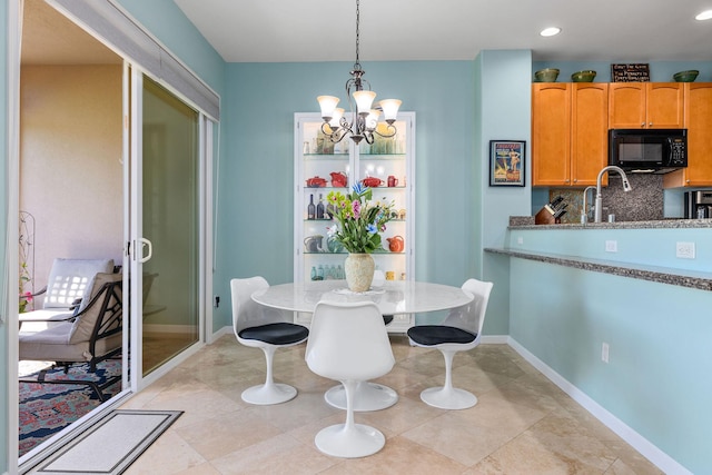 dining area with a notable chandelier, light tile patterned floors, recessed lighting, and baseboards