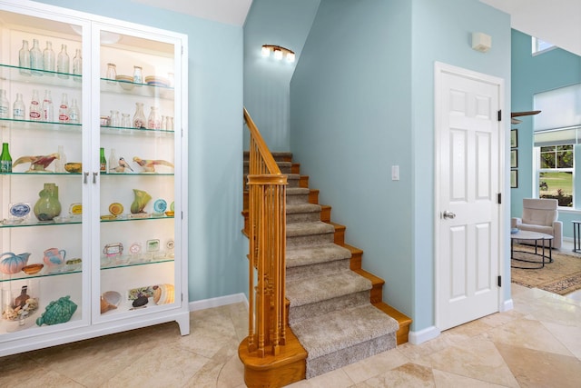 stairs featuring baseboards