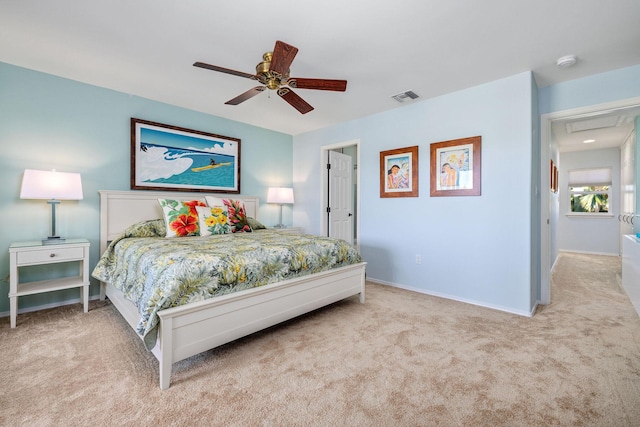 bedroom with baseboards, ceiling fan, visible vents, and light colored carpet