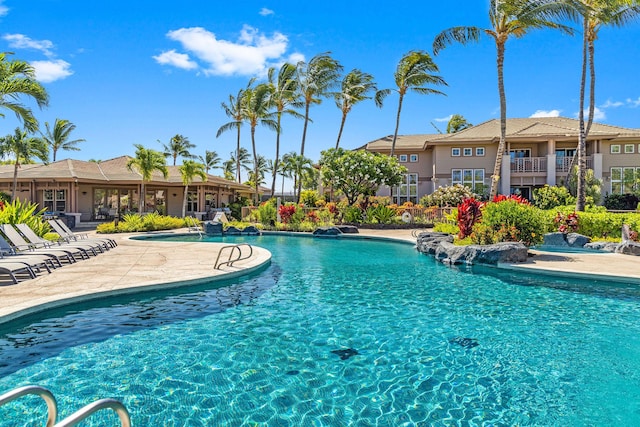 community pool with a patio area