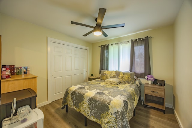 bedroom featuring a closet, ceiling fan, baseboards, and wood finished floors