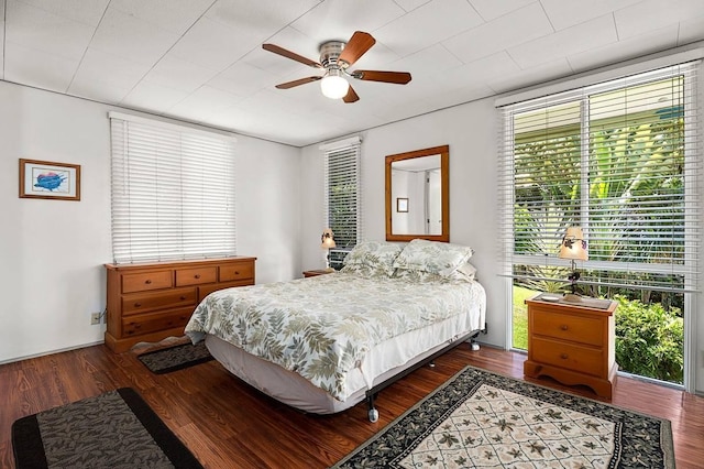 bedroom featuring ceiling fan and dark wood-style flooring