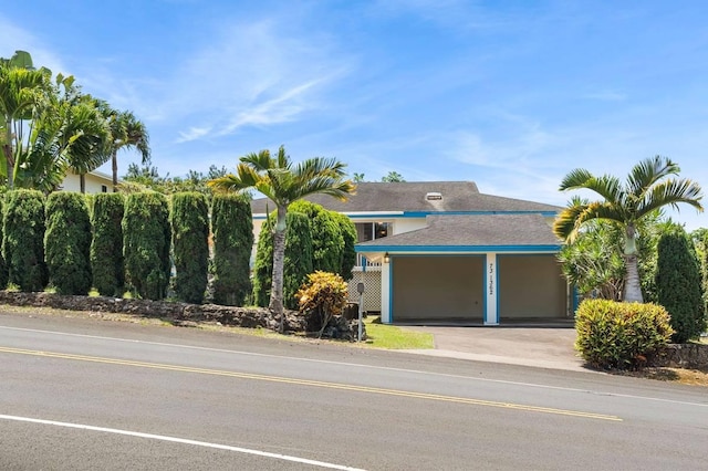 view of front of house featuring a garage and concrete driveway