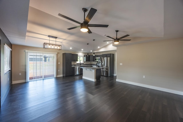 unfurnished living room featuring lofted ceiling, recessed lighting, a ceiling fan, baseboards, and dark wood finished floors