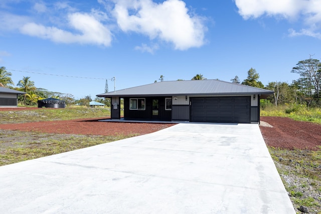 view of front facade with driveway and an attached garage