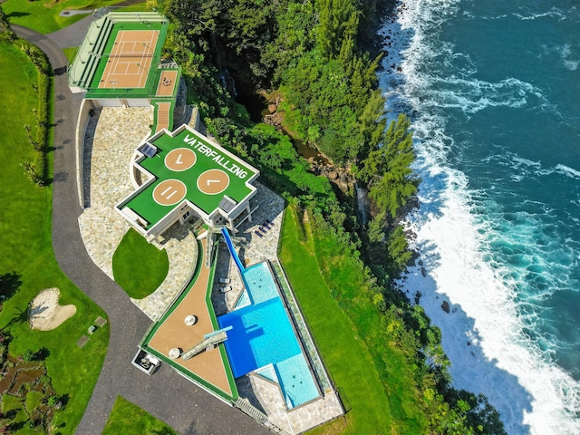 birds eye view of property with a water view