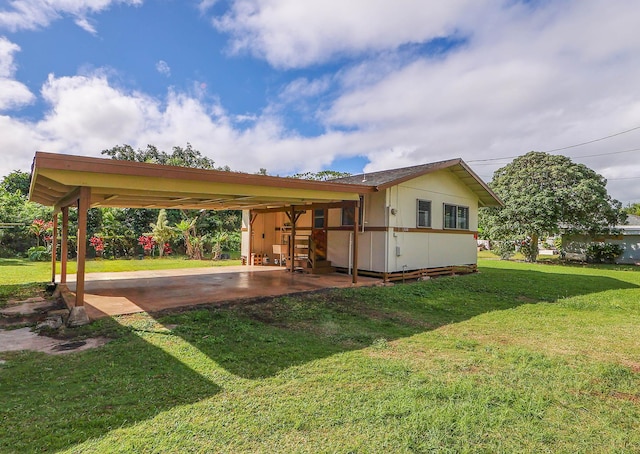 exterior space featuring driveway and a front yard