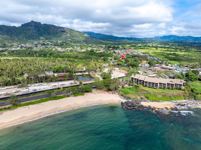 birds eye view of property featuring a beach view and a water and mountain view