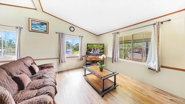 living room featuring lofted ceiling with beams, a textured ceiling, ornamental molding, and hardwood / wood-style floors