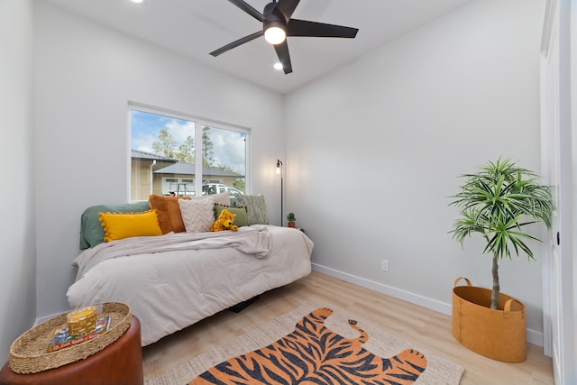 bedroom with recessed lighting, baseboards, ceiling fan, and light wood finished floors