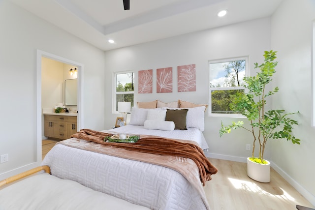 bedroom featuring baseboards, light wood-type flooring, connected bathroom, and recessed lighting