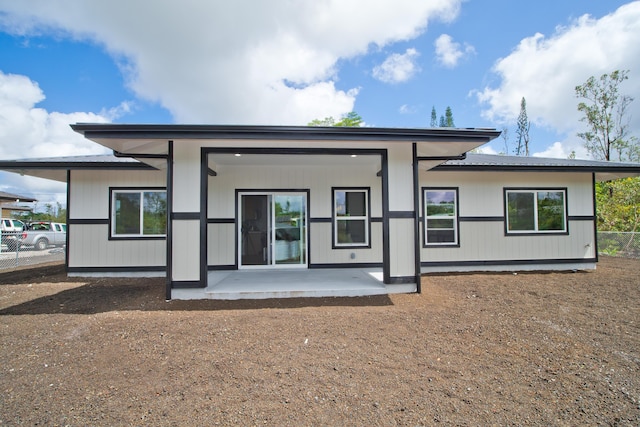 rear view of property with a patio area