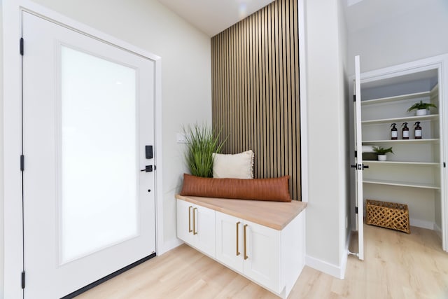 mudroom with light wood-type flooring and baseboards