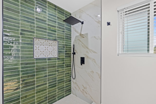 full bath with tiled shower