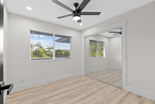 unfurnished bedroom featuring light wood finished floors, recessed lighting, and baseboards