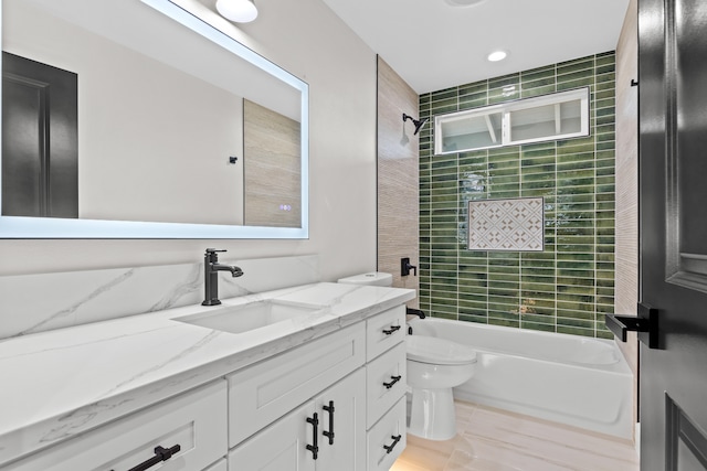 full bath with bathtub / shower combination, vanity, and toilet