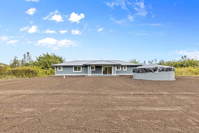 view of front of house featuring metal roof