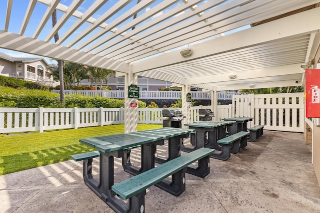 view of patio with fence, a grill, and a pergola