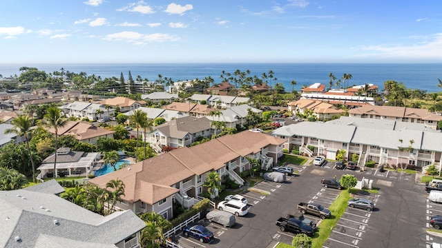 drone / aerial view featuring a water view and a residential view