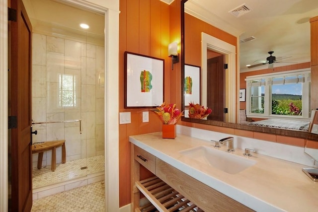 full bathroom featuring ornamental molding, visible vents, a shower stall, and vanity