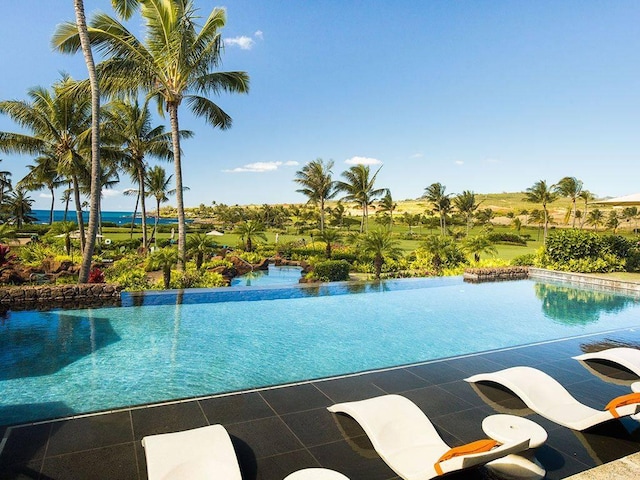 view of pool with an infinity pool