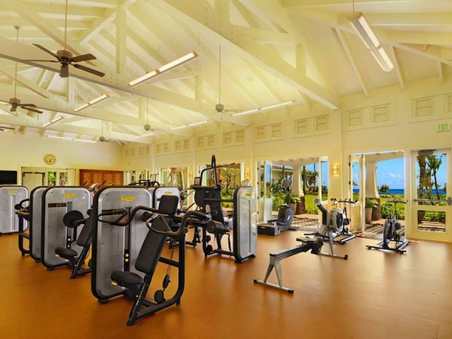 workout area with ceiling fan and high vaulted ceiling