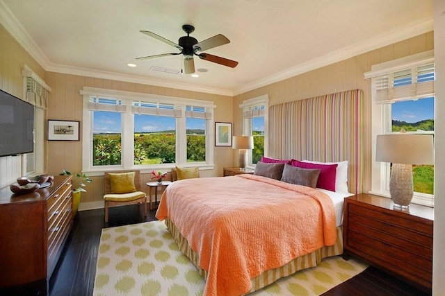 bedroom featuring hardwood / wood-style flooring, a ceiling fan, and crown molding