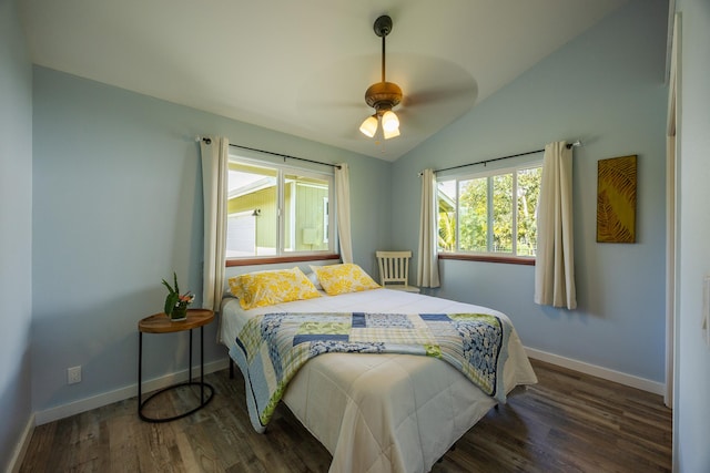 bedroom featuring vaulted ceiling, baseboards, and wood finished floors