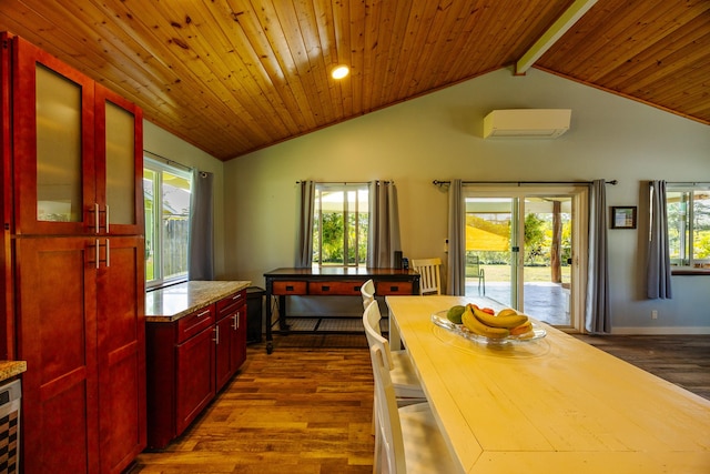 kitchen with reddish brown cabinets, dark wood-style flooring, lofted ceiling with beams, wood ceiling, and an AC wall unit