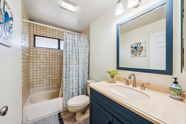 bathroom featuring shower / tub combo, vanity, toilet, and wood finished floors