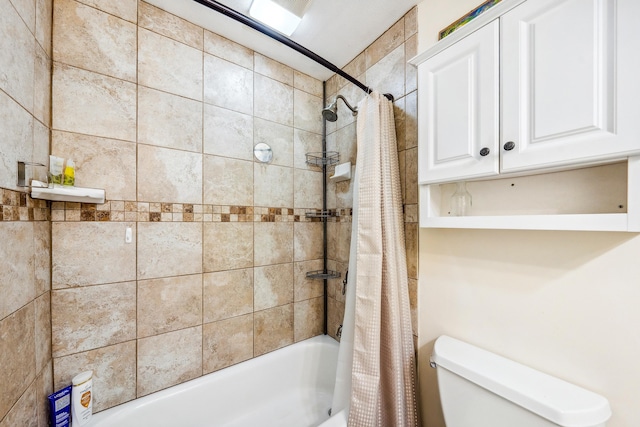 bathroom with toilet and shower / bath combo