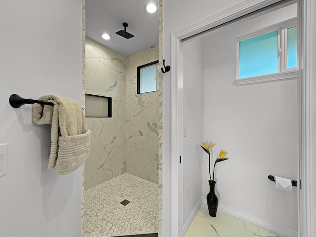 full bath featuring marble finish floor, a marble finish shower, baseboards, and recessed lighting