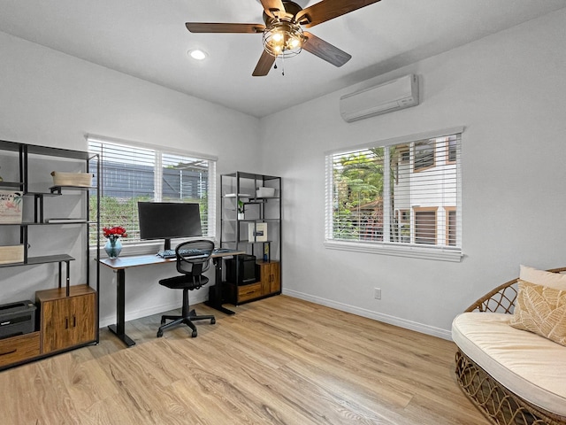 office space with recessed lighting, a wall unit AC, baseboards, and wood finished floors