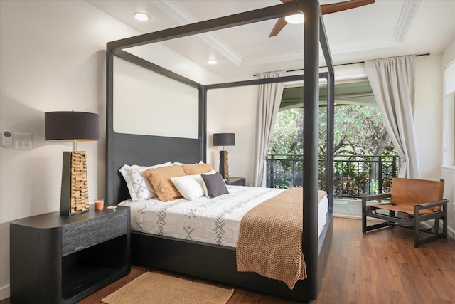 bedroom featuring recessed lighting, a tray ceiling, dark wood-type flooring, and ornamental molding